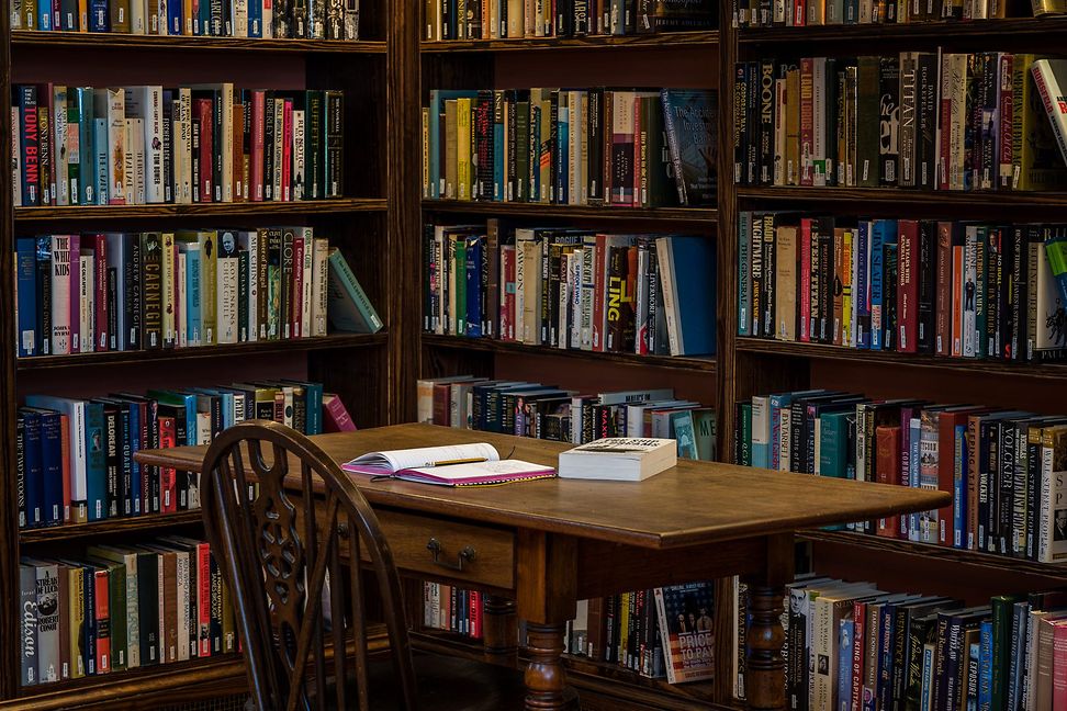 Desk with books in a corner in the library of mistakes