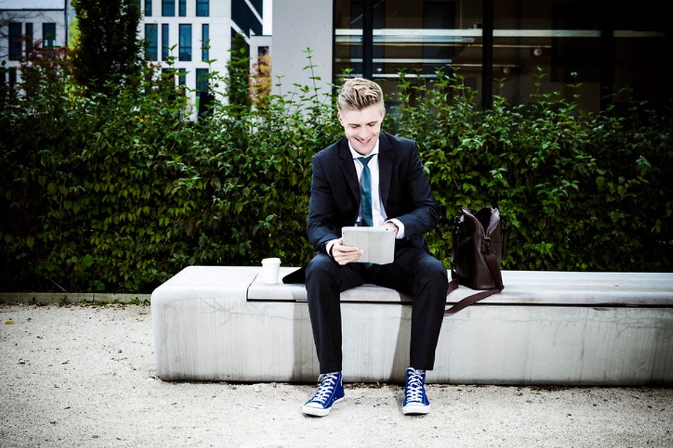 Man in a business suit and sneakers