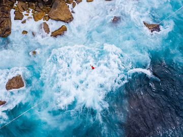 A tightrope walk over rocky waters