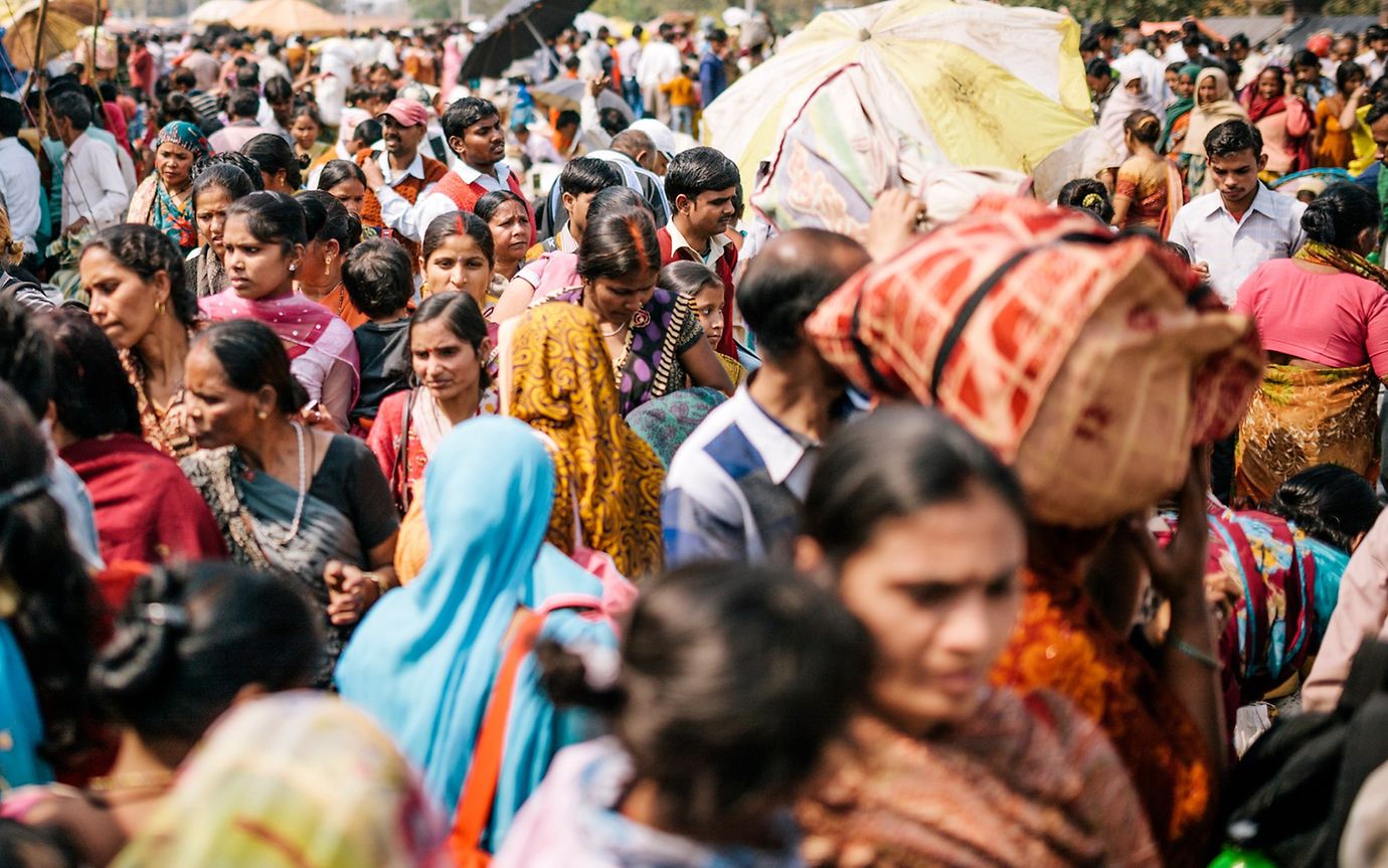 People crowded into a busy street in Delhi, India