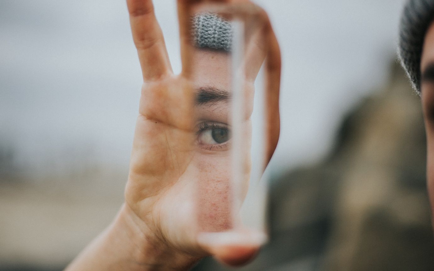 Woman looking into a mirror