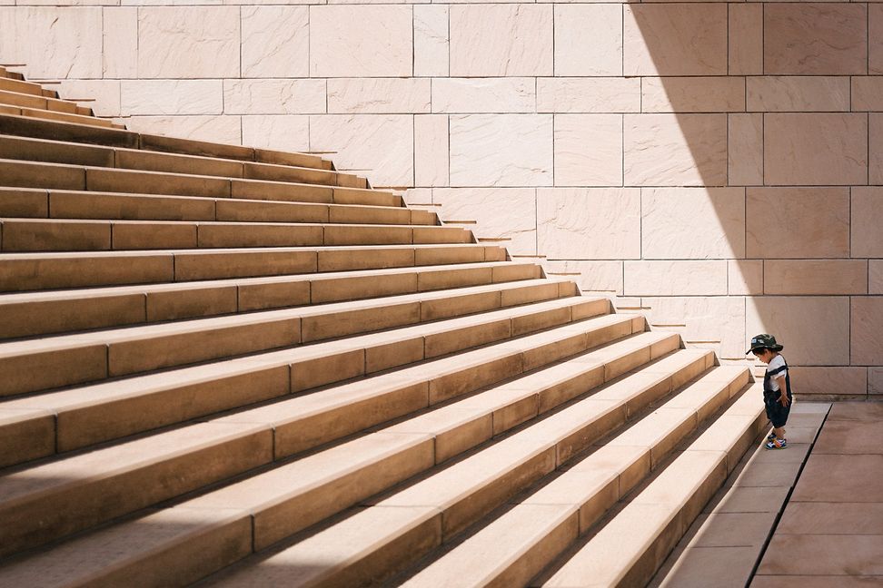 A child in front of steps