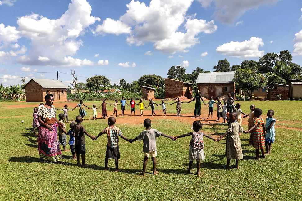 The group of children in a circle holding hands