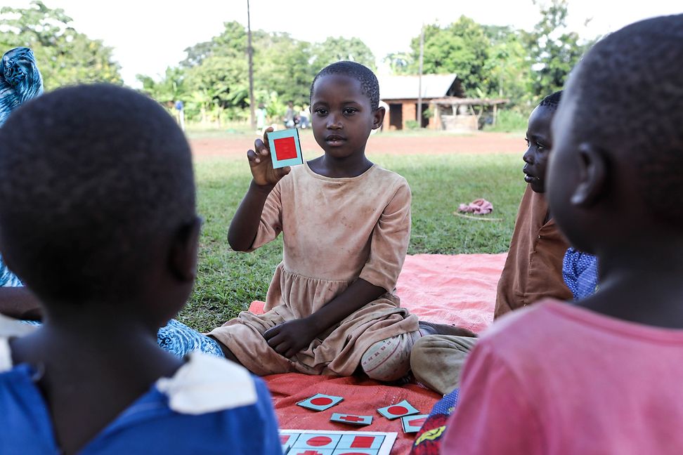 Child showing a card