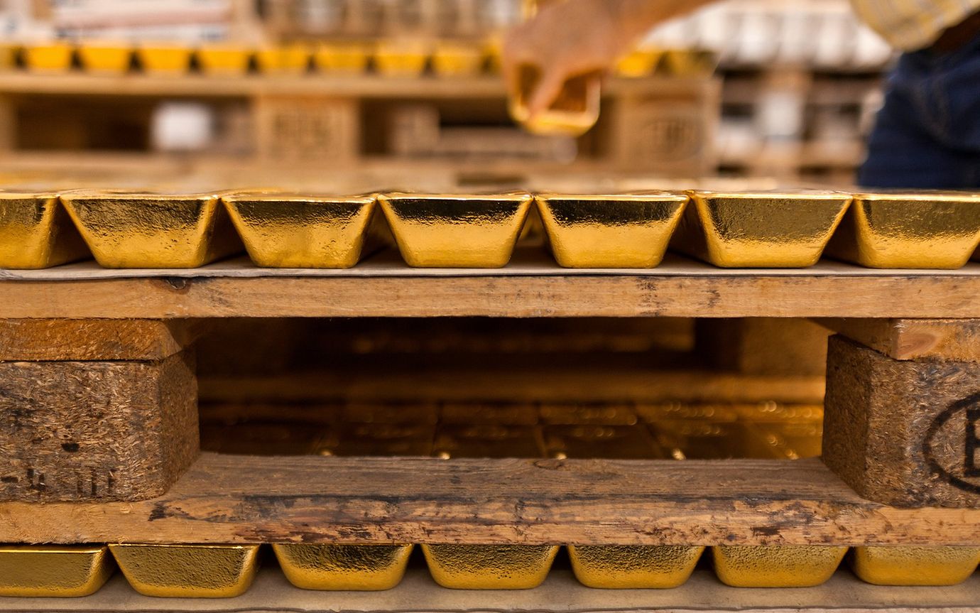 Stacked gold bars in a bank vault