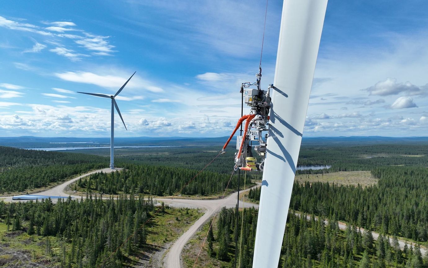 An Aerones robot is pulled up a wind turbine wheel