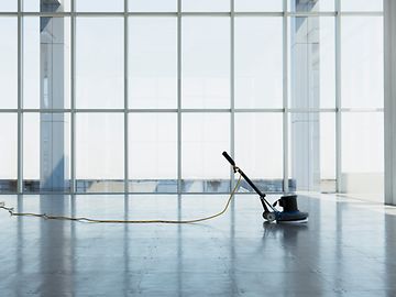 Vacant office space with cleaning machine