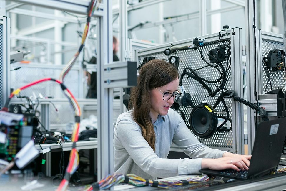 A woman working in a technical environment