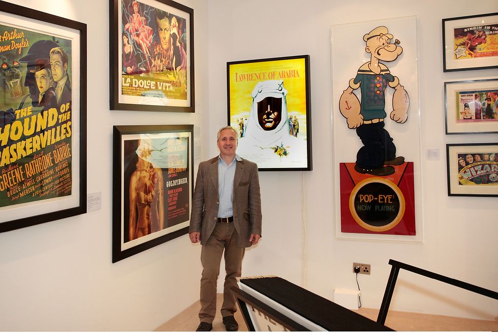 Bruce Marchant surrounded by his posters