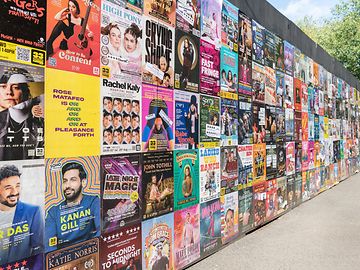 Colourful wall of Edinburgh Fringe posters