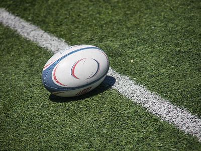 Rugby ball on lush green field