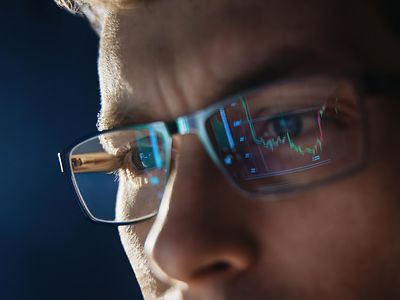 man wearing glasses reflection of screen