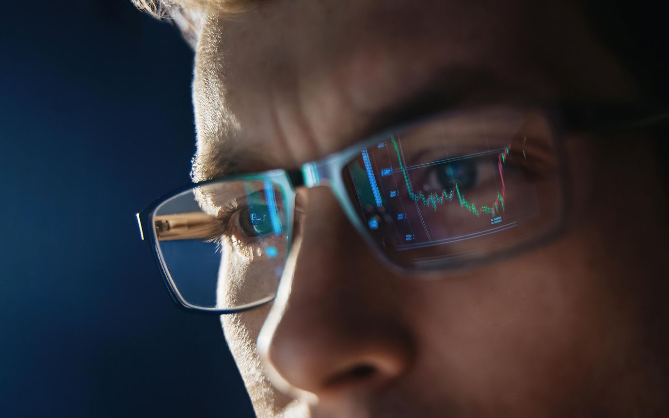 man wearing glasses reflection of screen