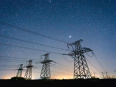 electricity power lines against starry sky 