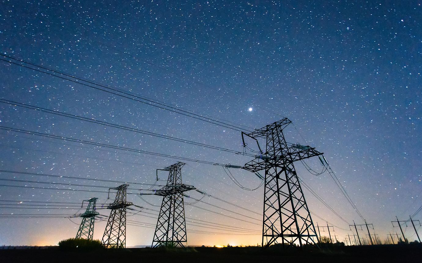 electricity power lines against starry sky 