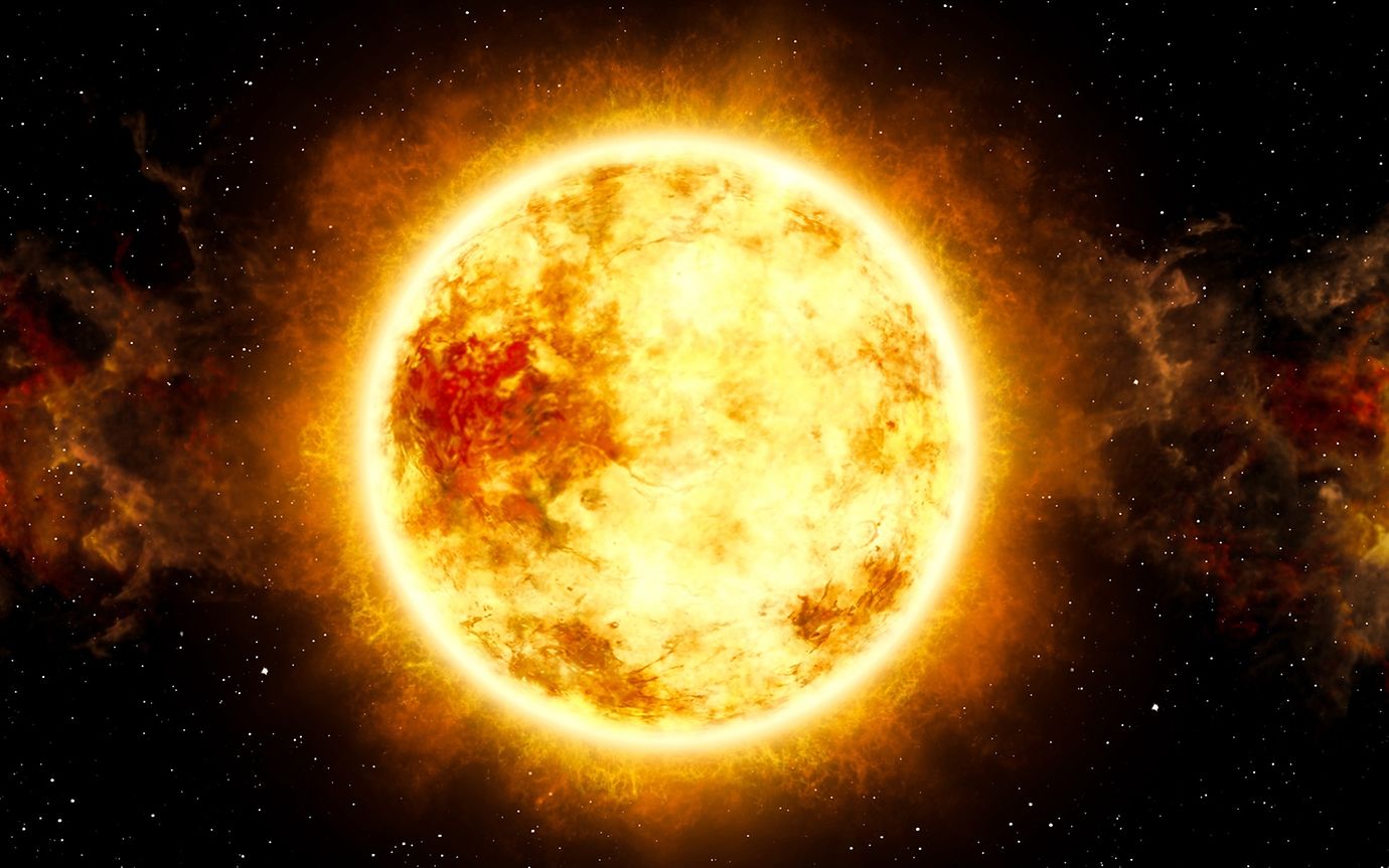 The sun is a mighty ball of energy in glistening yellow and shades of red, floating in black space.